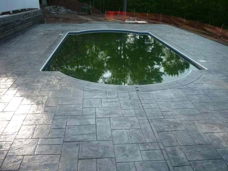 Stamped concrete patio with firepit surround